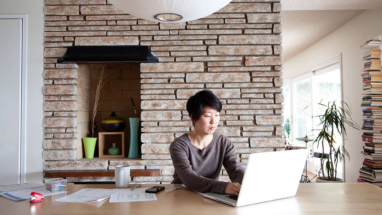 Woman paying mortgage on computer