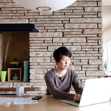 Woman paying mortgage on computer