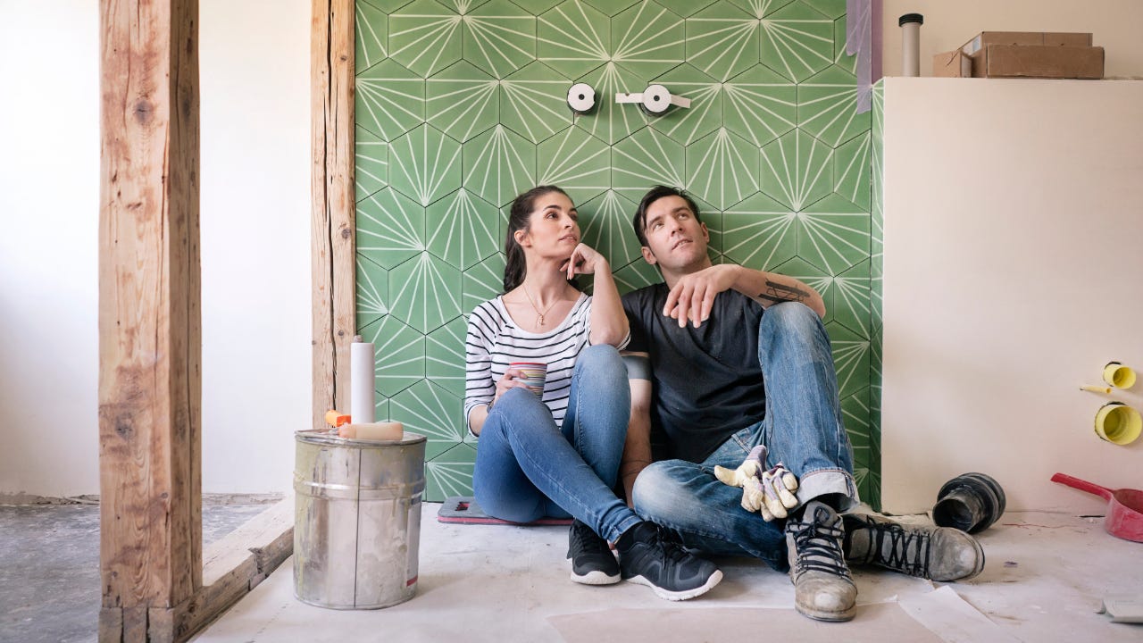 Couple pondering home renovation