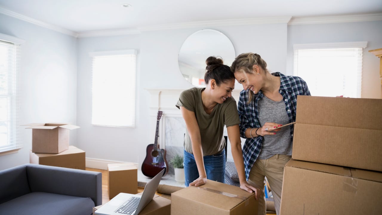 Couple unpacking boxes