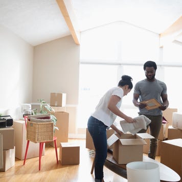 a couple unpacking boxes