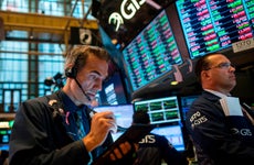 Traders work after the opening bell at the New York Stock Exchange