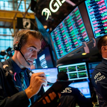 Traders work after the opening bell at the New York Stock Exchange