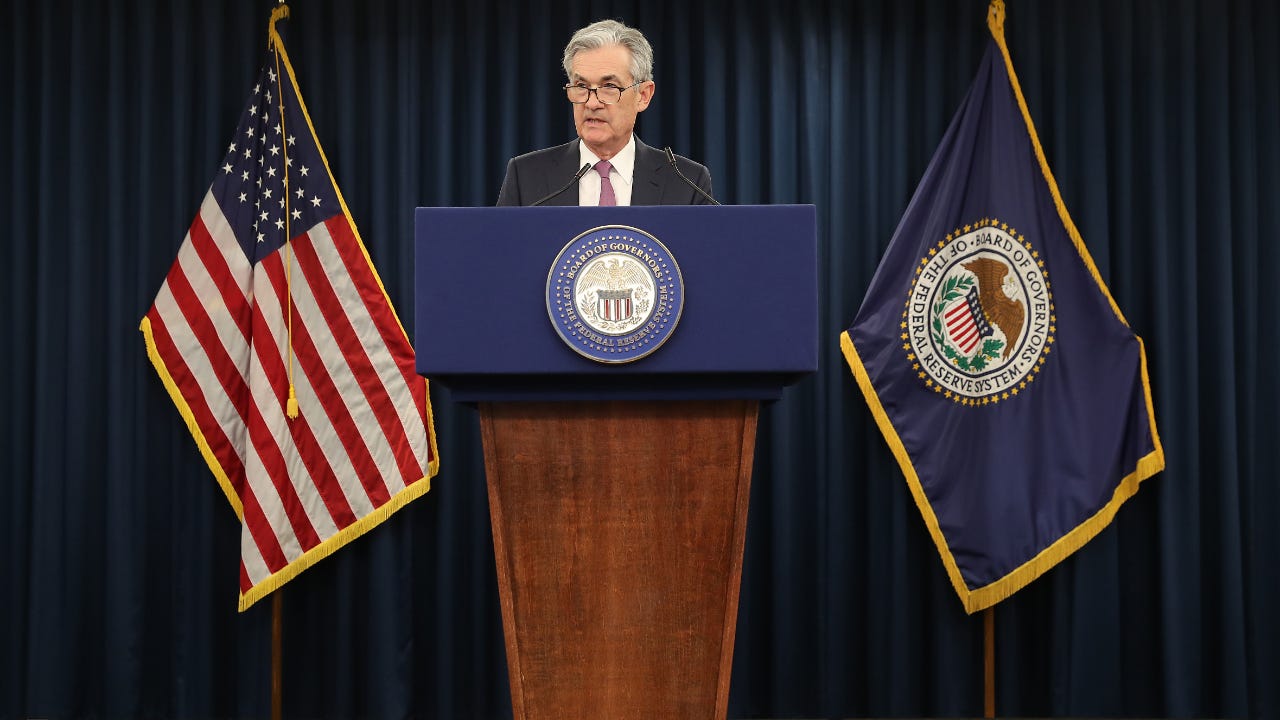 Fed Chairman Jerome Powell speaks to journalists at a June 19 press conference