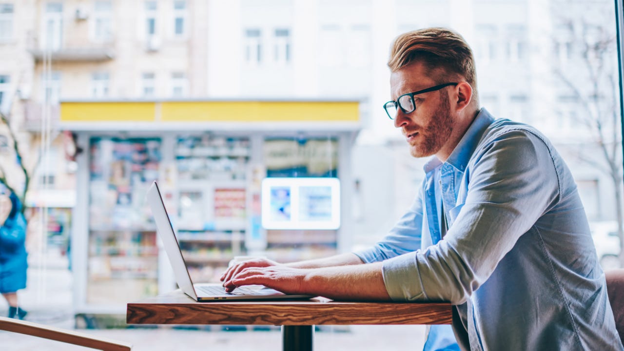 Picture of a young man trading at a coffee shop