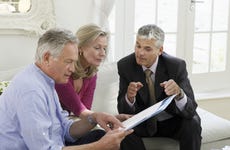 An adviser consults an older couple about retirement
