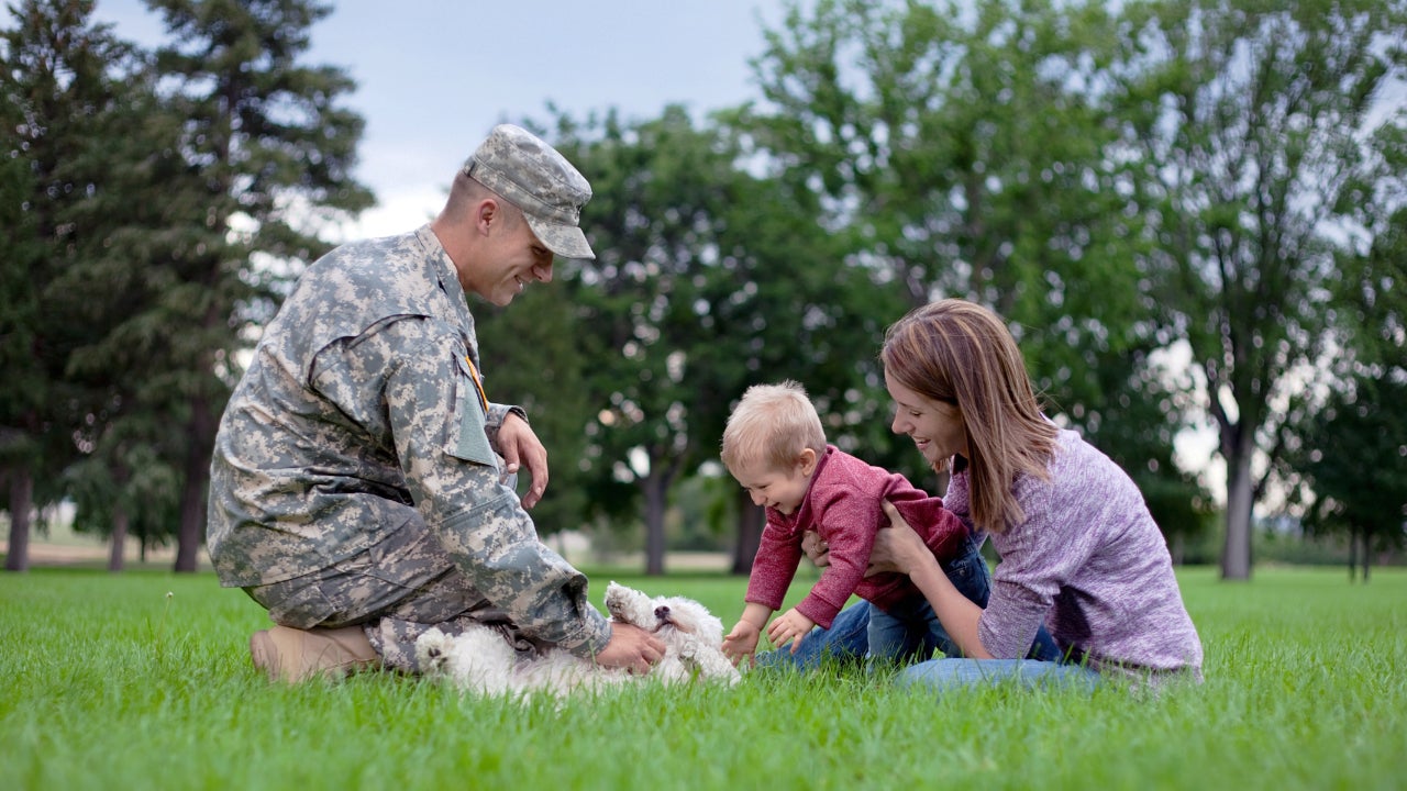 soldier with family and dog