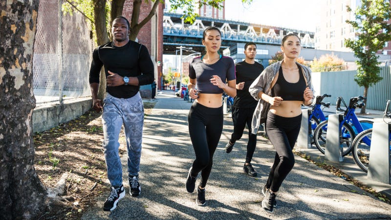 Group of people running in New York City.