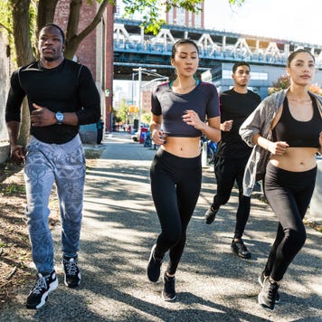Group of people running in New York City.