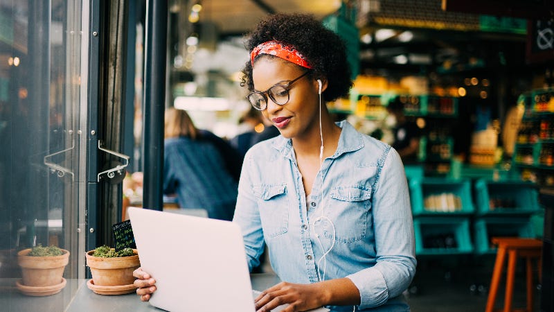 A woman does research online.