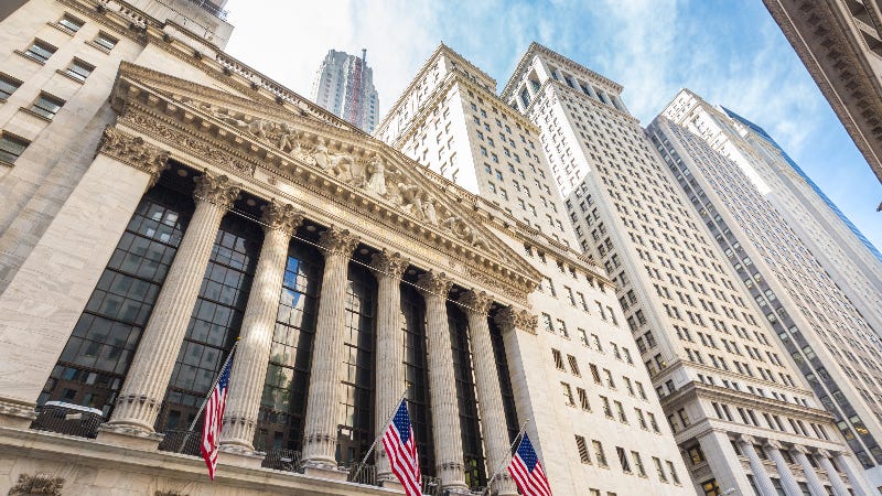 A picture of the New York Stock Exchange and surrounding New York buildings