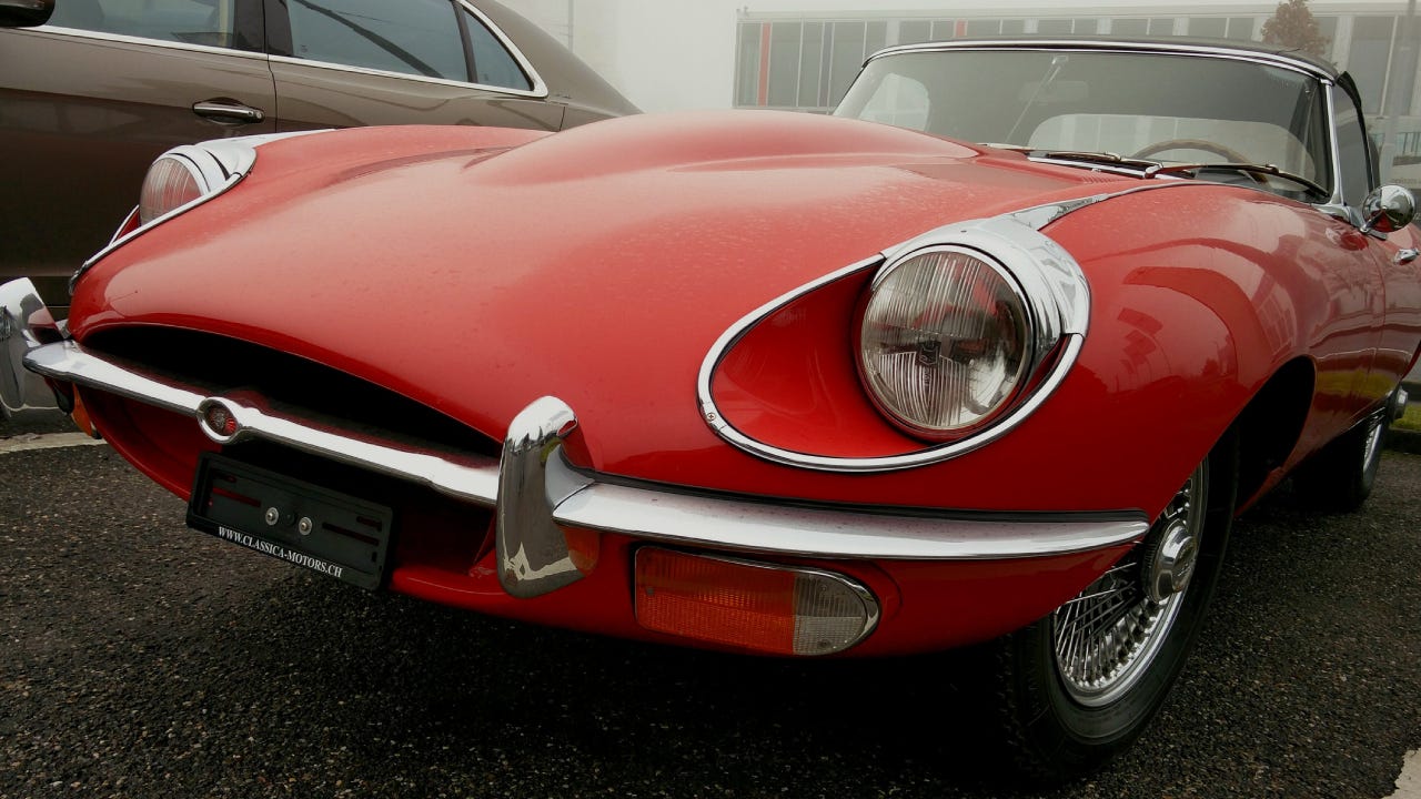 Close-up of a red, classic car.