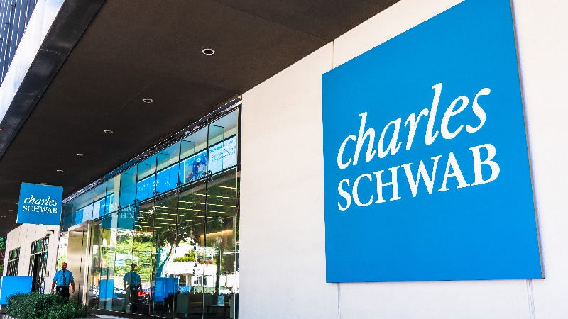 A picture of a Charles Schwab office and logo