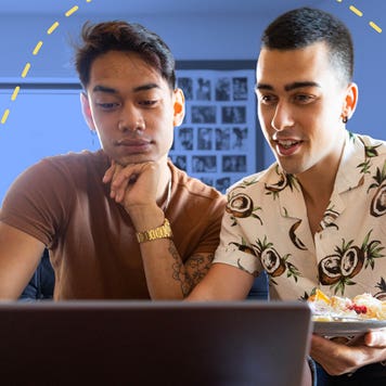 Gay couple looking up finances on computer
