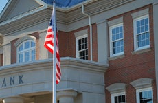 Outside view of a bank with American flag