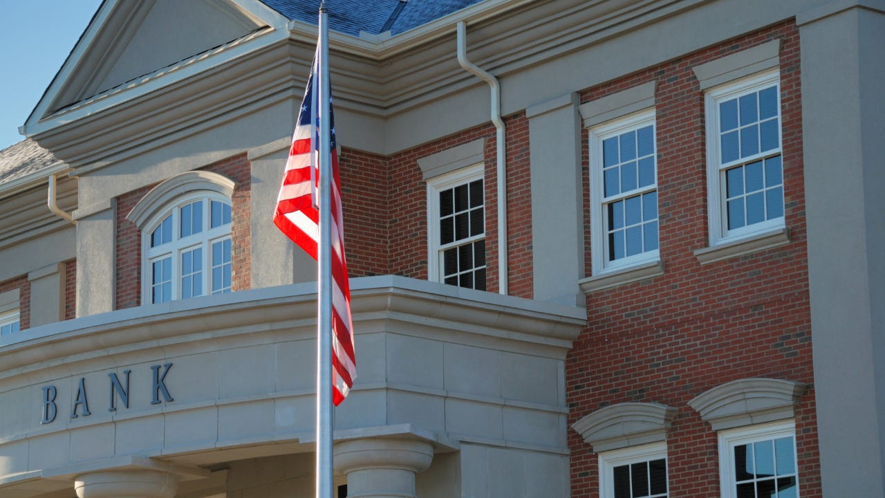 Outside view of a bank with American flag