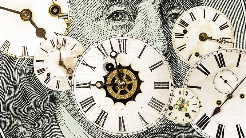 Clocks are displayed across an image of a dollar bill.