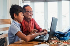 Grandfather and grandson on computer