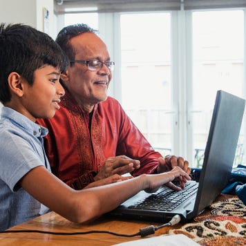 Grandfather and grandson on computer