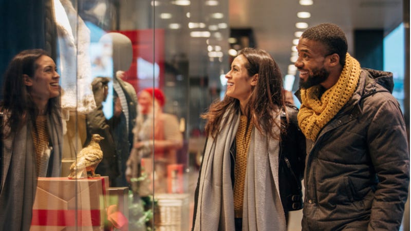Happy couple window shopping during the holidays