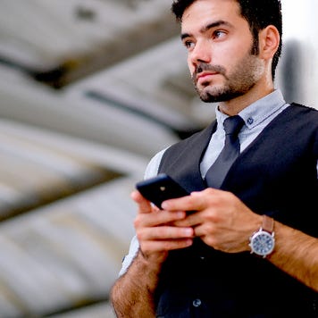 Man looks at his phone.