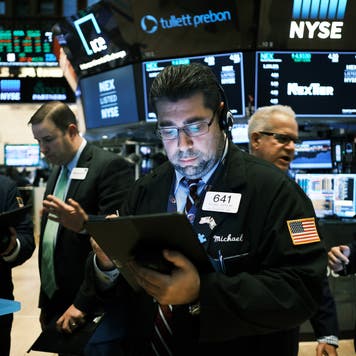 Traders work on the floor of the New York Stock Exchange.