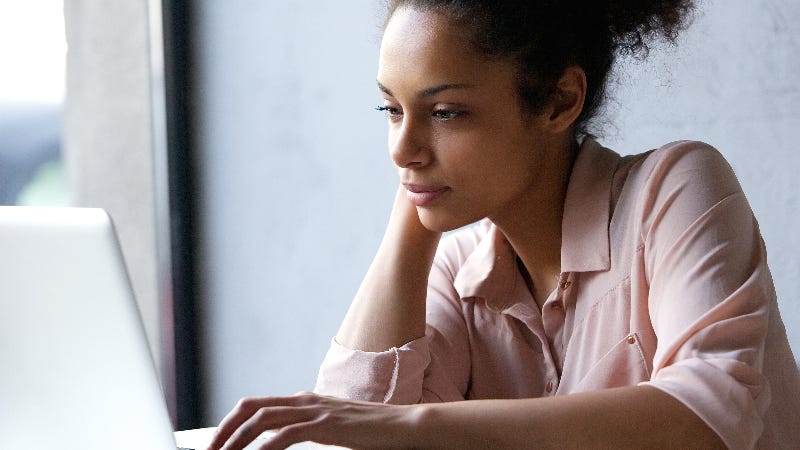 A woman researches online.