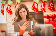 Woman using tablet at Christmas