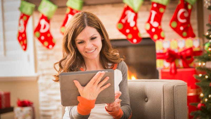 Woman using tablet at Christmas