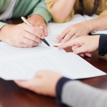 Couple signing contract