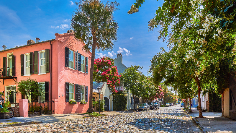Historic buildings down a cobblestone street in Charleston, South Carolina.