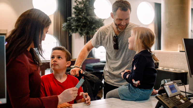 Family in front of a desk
