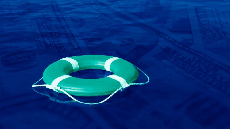A swimming tube floating on a pool of money.