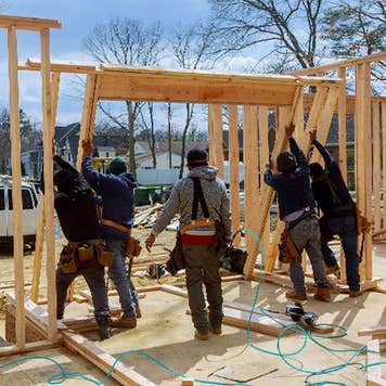 Men building home
