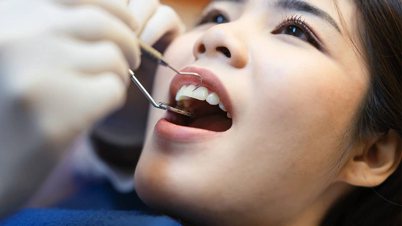 Woman getting dental work done