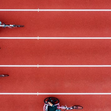 A photo of paracylcists racing along a track