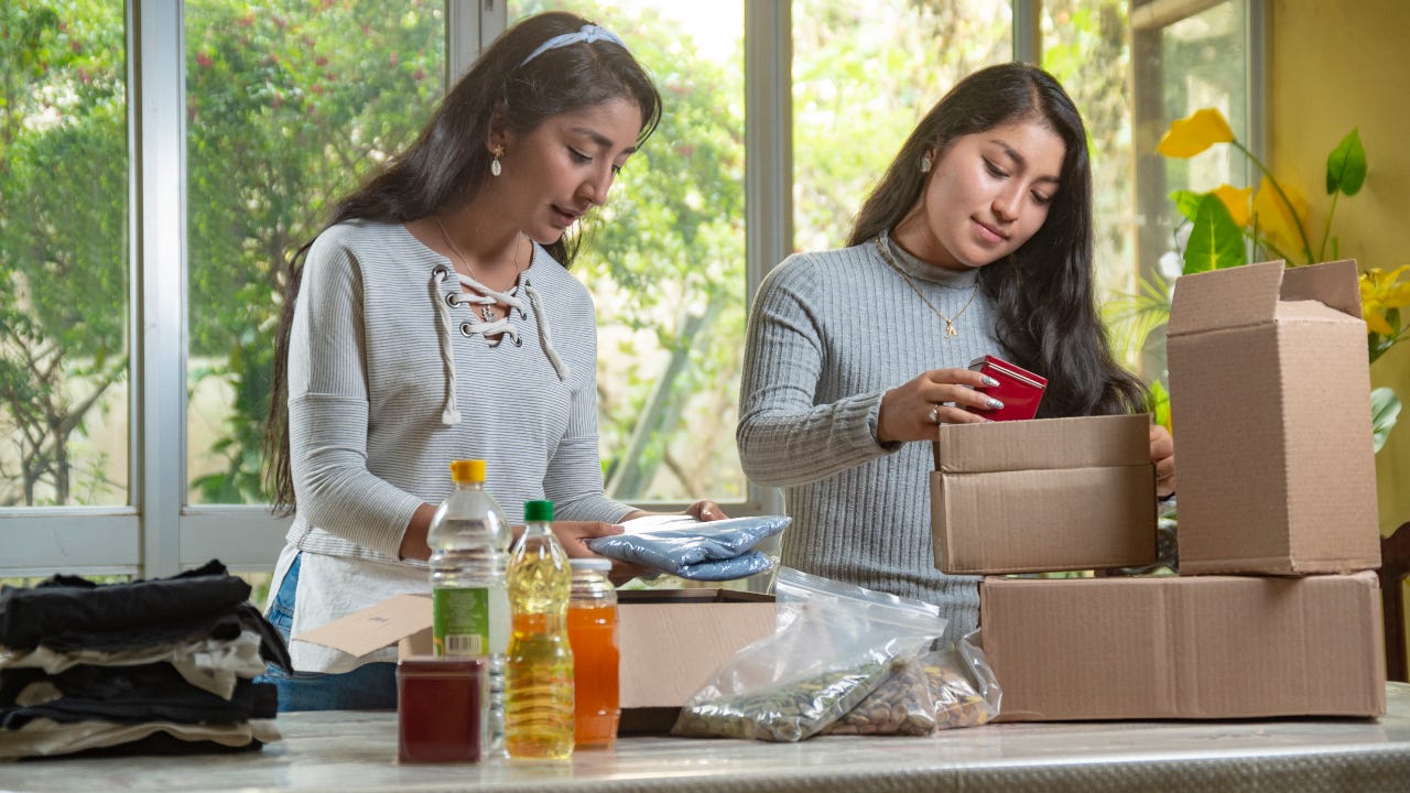 Women preparing charity boxes