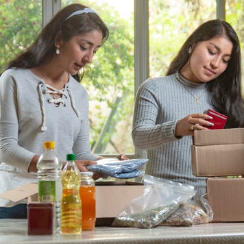 Women preparing charity boxes