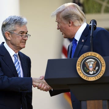President Donald Trump shakes the hand of Fed Chairman Jerome Powell