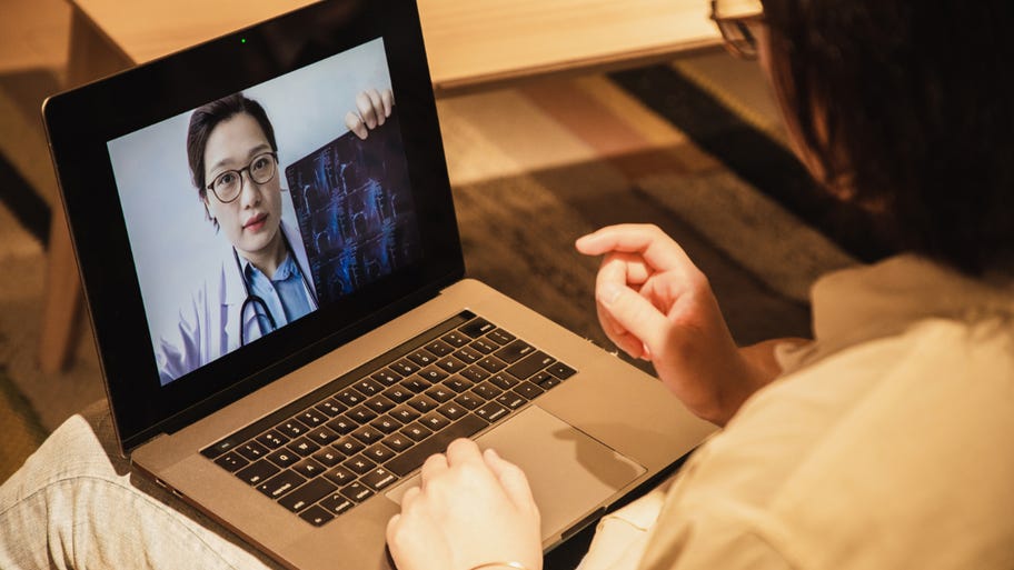 Consulting doctors online using laptop