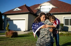 Soldier in uniform coming home and his family