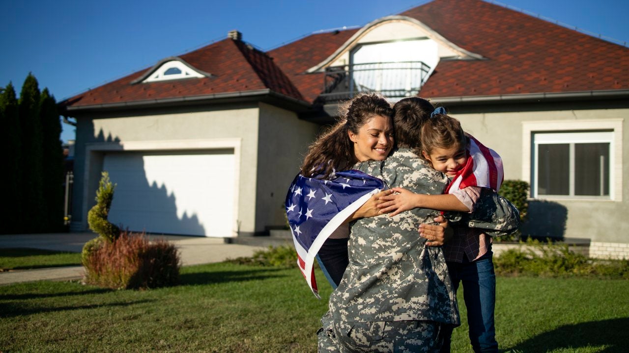 Soldier in uniform coming home and his family