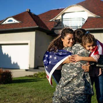 Soldier in uniform coming home and his family