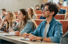 Students in classroom attend a lecture.