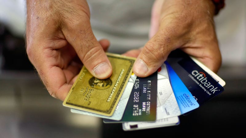 Person holding credit cards