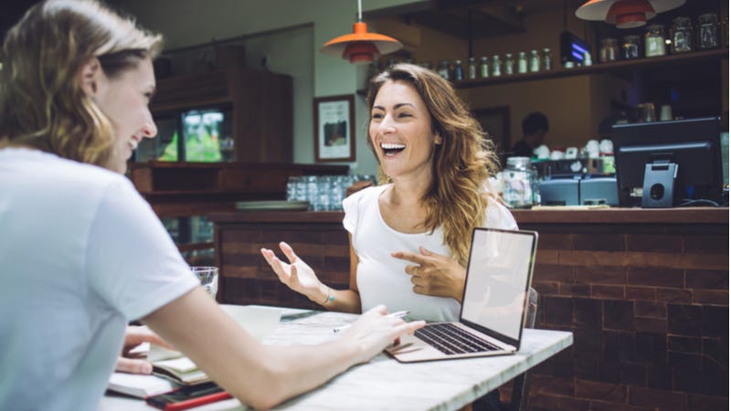 Young women having business meeting in restaurant