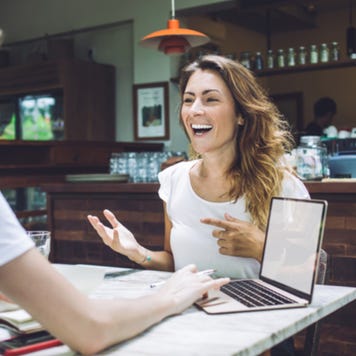 Young women having business meeting in restaurant