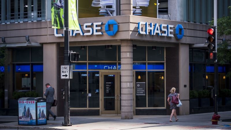 Customers walk past a Chase Bank branch.