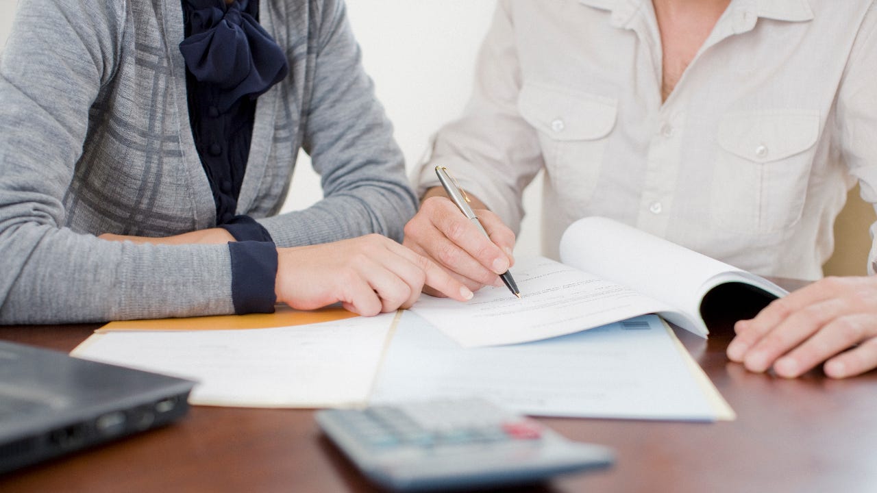 Person signing paperwork