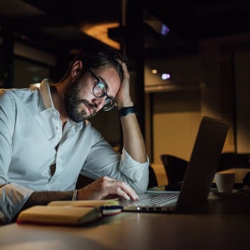 Man on his laptop at night
